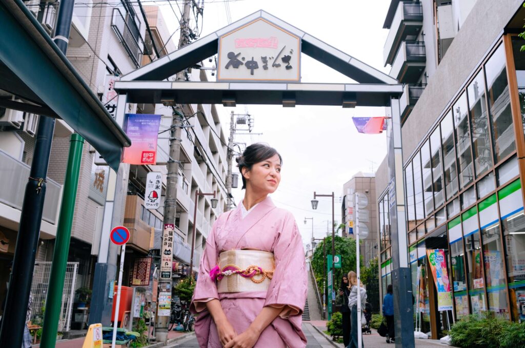 Woman in traditional kimono exploring Yanaka Ginza in Tokyo Japan